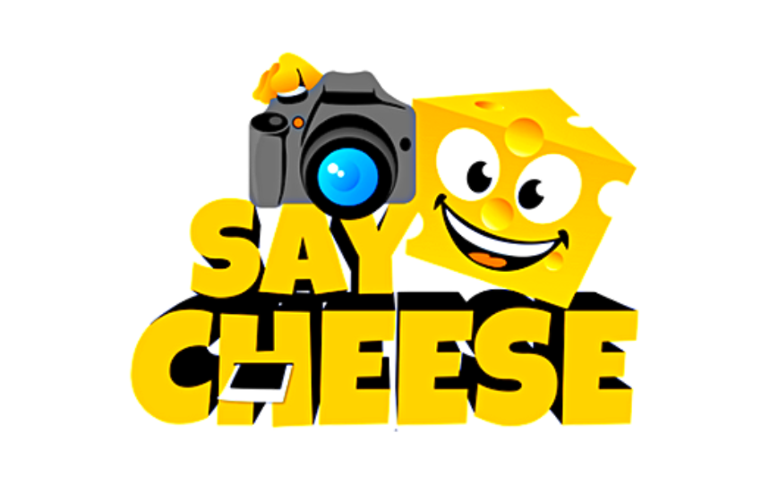 Say Cheese with Yellow writing and a piece of cheese with a face on it holding a camera
